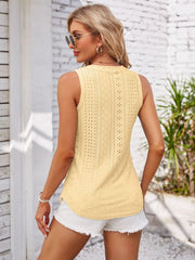 Light yellow eyelet button-down sleeveless top with a textured pattern.