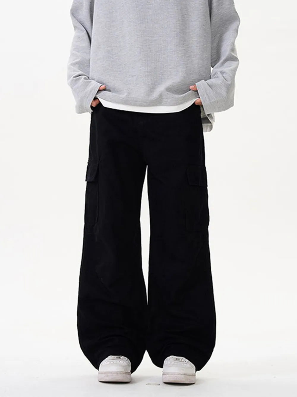 Black cargo pants with versatile pockets and a relaxed fit.