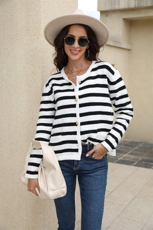 Black and white striped crewneck cardigan with button front and pockets.