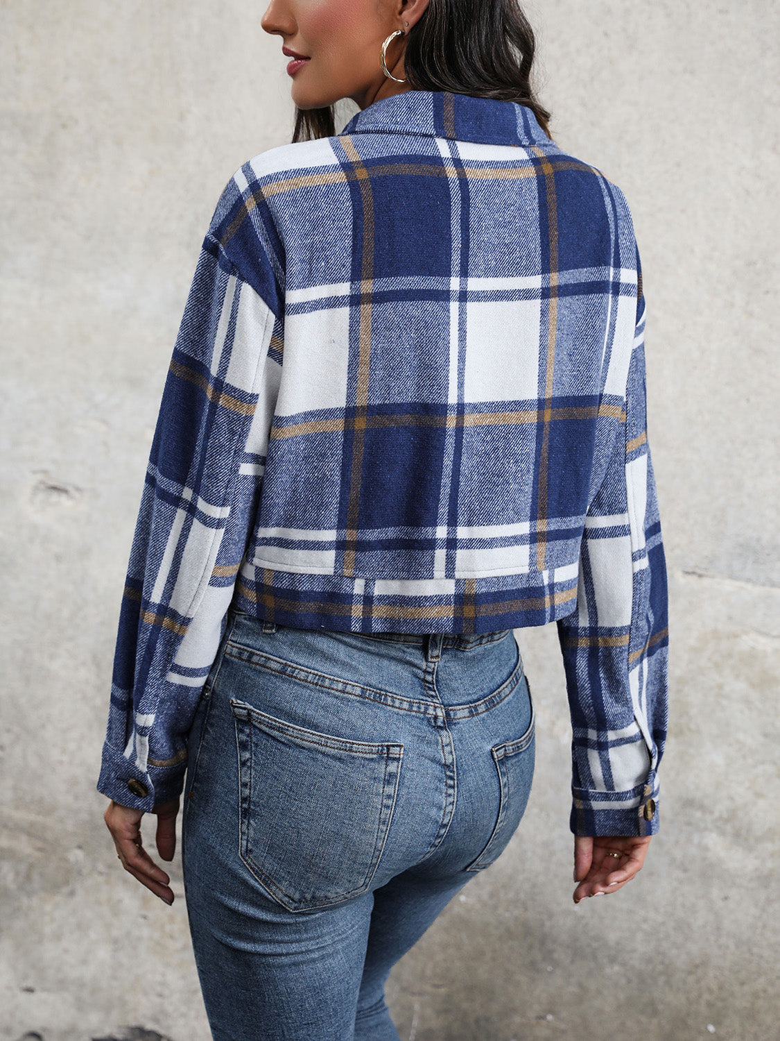 Checked plaid shacket in blue and white with buttoned cuffs and collar.