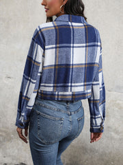 Checked plaid shacket in blue and white with buttoned cuffs and collar.