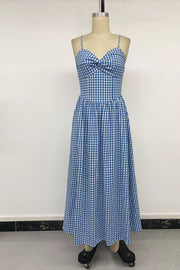 Blue gingham midi dress with spaghetti straps and a knot-front bodice.