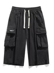 Black cargo shorts with zippered pockets and drawstring waist