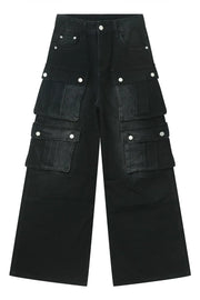 Oversized dark denim cargo pants with multiple flap pockets and button closures.