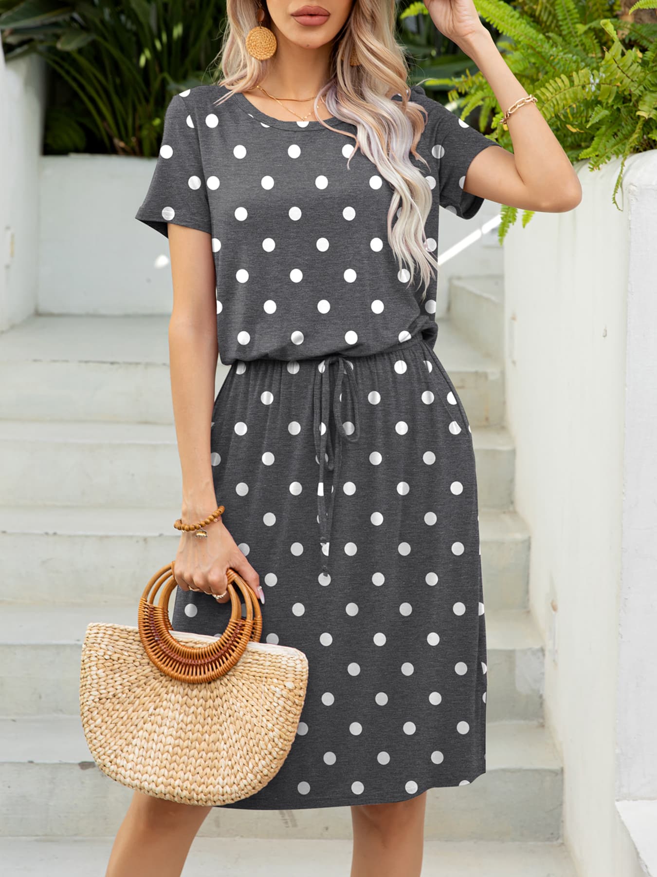 Gray polka dot midi dress with drawstring waist and short sleeves.