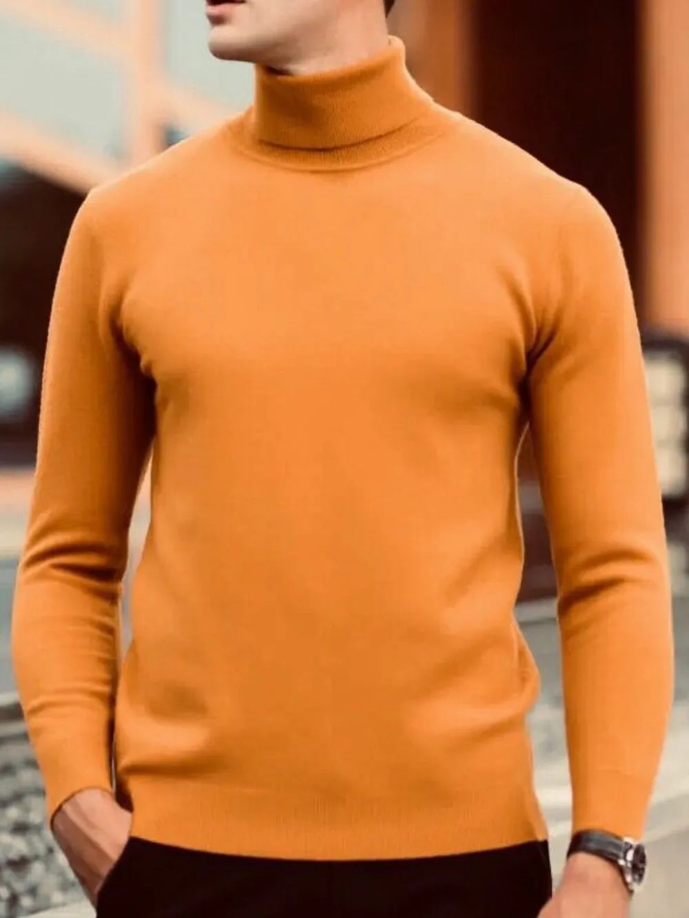Tangerine turtleneck knit sweater with a modern silhouette and long sleeves.