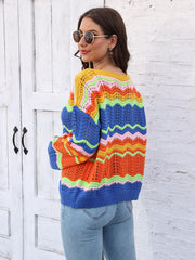 Crochet sweater with rainbow chevron stripes in yellow, pink, green, orange, and blue, featuring an open knit design.