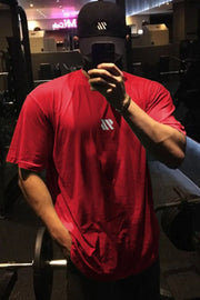 Logo Detail Oversized Tee in Deep Red with a small white logo detail on the chest.