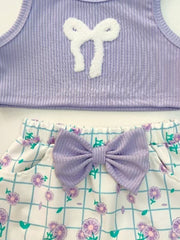 Lavender ribbed tank top with white bow detail and floral grid print shorts with lavender bow