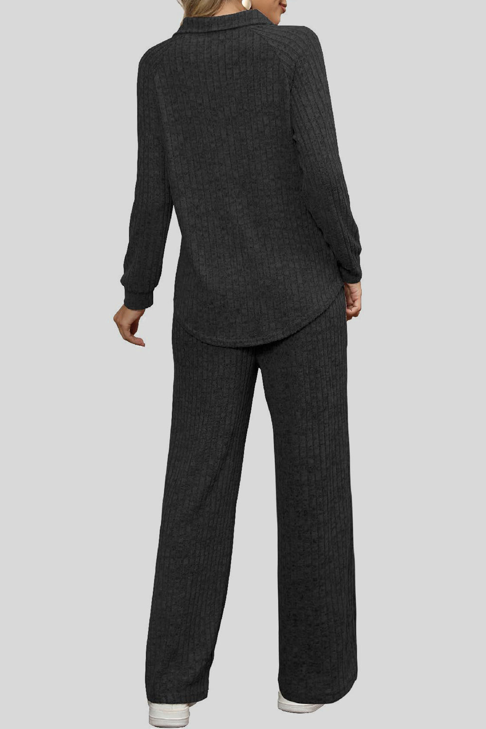 Black ribbed knit lounge set with collar and wide leg pants.