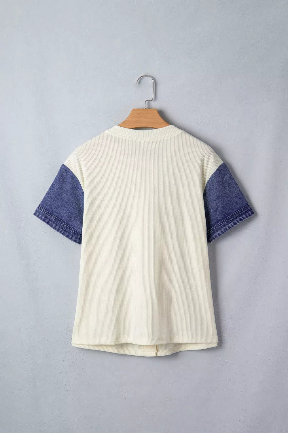 Cream ribbed knit maternity shirt with short denim sleeves and button details.