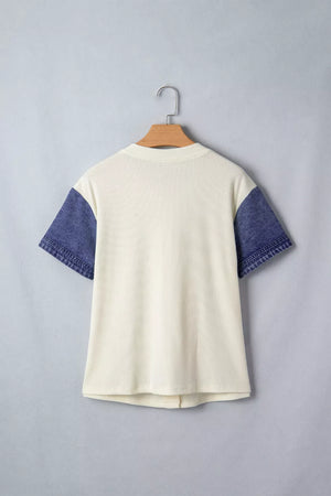 Cream ribbed knit maternity shirt with short denim sleeves and button details.