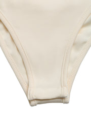Cream sleeveless bodysuit with snap closure and ribbed trim.