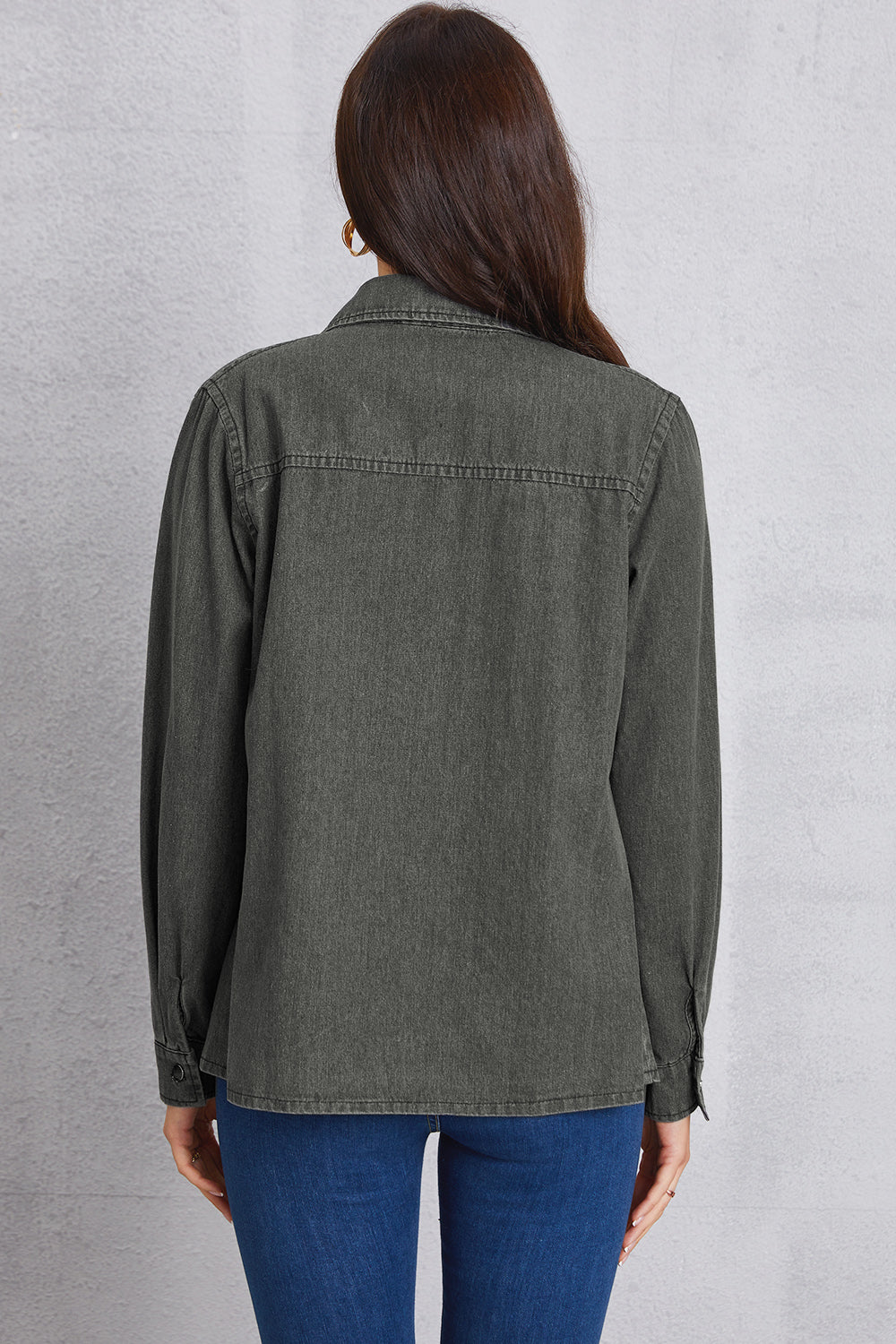 Washed dark gray denim shirt with pointed collar and button cuffs, shown from the back.