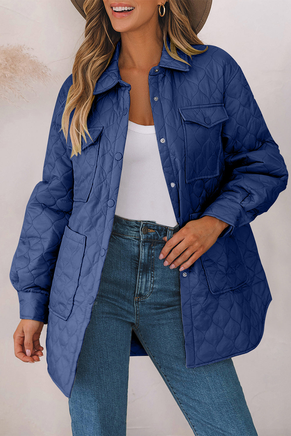 French Blue quilted utility jacket with chest pockets and a collared neckline.