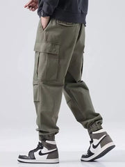 Army green relaxed fit cargo sweatpants with multiple pockets and elastic cuffs.