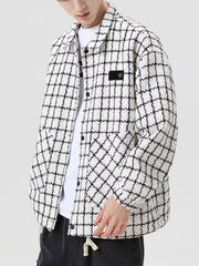 Oversized white plaid button-up jacket with black checks and a patch detail.