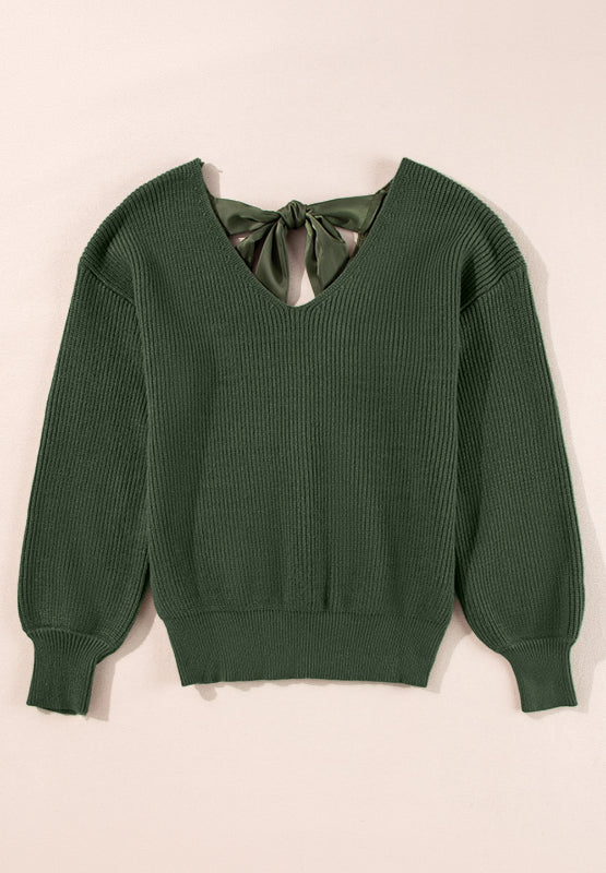 Dark green ribbed knit sweater with a V-neck and satin bow detail at the back.