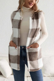 Oversized sherpa gilet with buffalo check pattern in tan and white, featuring patch pockets.
