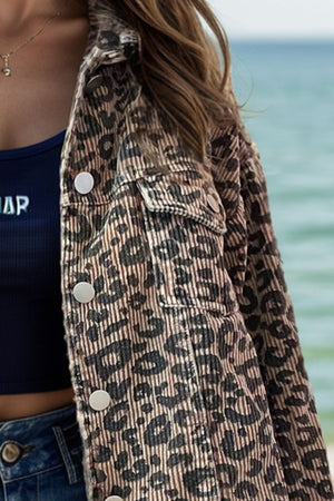 Leopard print corded cropped jacket with button front and chest pockets.