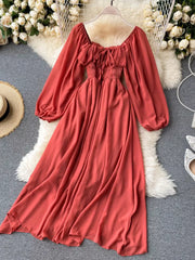 Maternity A-line dress in watermelon red with square neck, ruffled detail, tie front, smocked waist, and balloon sleeves.