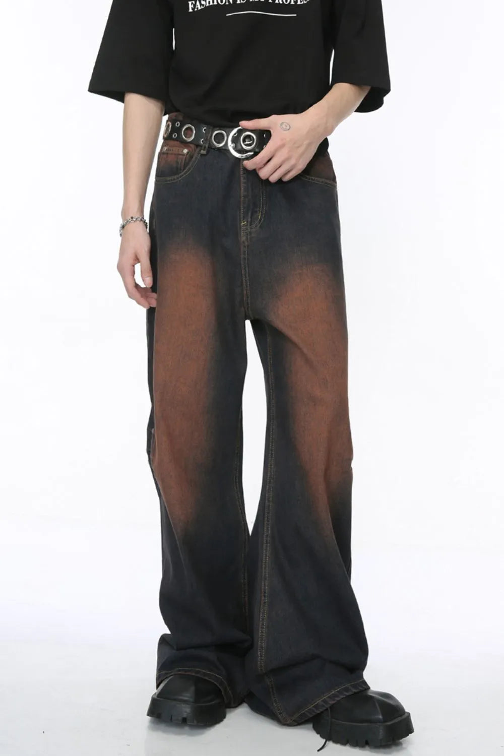 Acid wash flare jeans in dark denim with a gradient brown pattern and silver stud detailing.