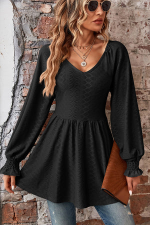 Black textured empire waist blouse with shirred sleeves and v-neck