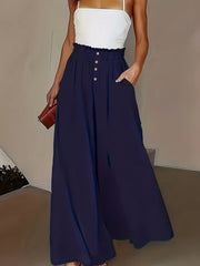 Dark blue wide-leg pants with paperbag waist and button detail.