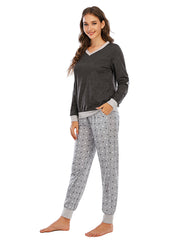 Dark grey v-neck lounge set with contrast trim and grey polka dot pants