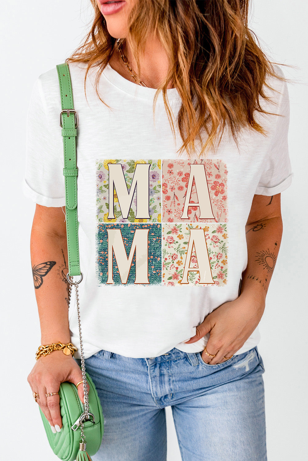 White Mama graphic tee with floral collage squares and rolled sleeves.