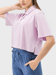 Cropped polo shirt in blush pink with short sleeves and a relaxed fit.