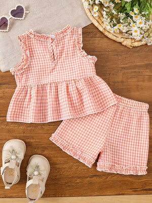 Children's blush pink gingham ruffle two-piece set, cotton, with ruffled shorts and peplum top.