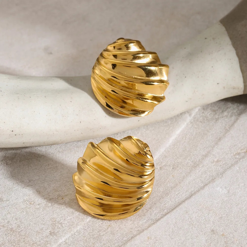Gold sculpted spiral stud earrings with 18K gold plating.