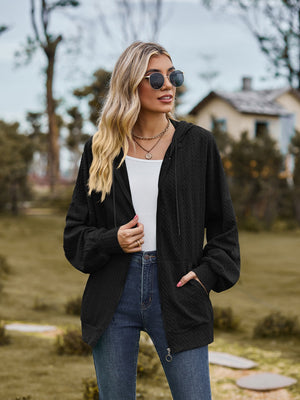 Black textured knit dolman sleeve zip-up hoodie with drawstring hood and pockets.