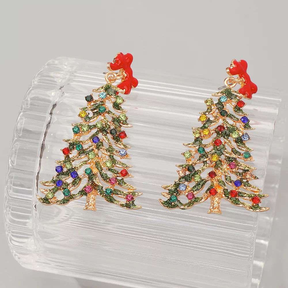 Festive dangle earrings shaped like Christmas trees with colorful rhinestones and red bows.