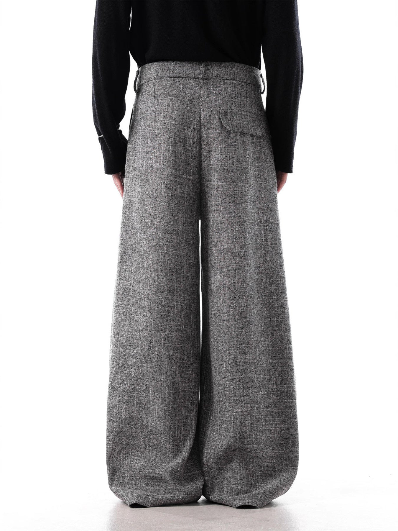 Men's grey oversized pleated wide-leg trousers with decorative chain detail