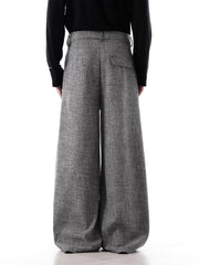 Men's grey oversized pleated wide-leg trousers with decorative chain detail