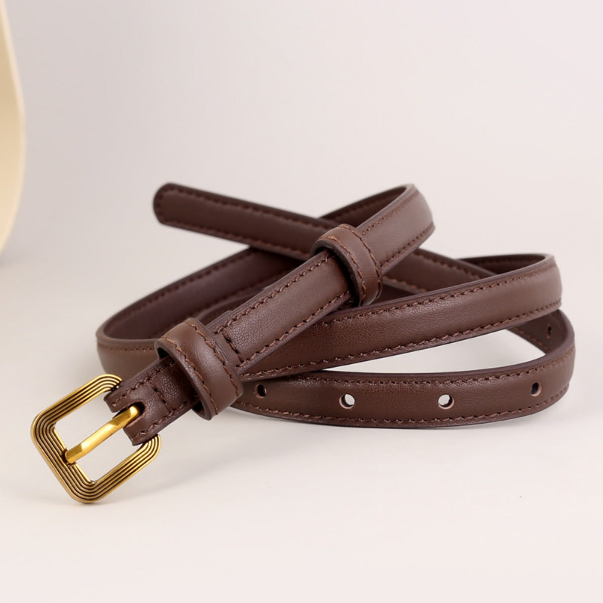 Brown cowhide leather accent belt with antique brass buckle and keeper loop.