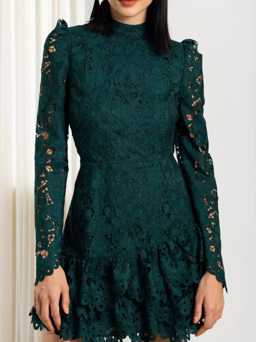 Dark green floral lace mock neck mini dress with long sleeves and ruffled hem.