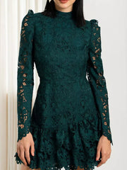 Dark green floral lace mock neck mini dress with long sleeves and ruffled hem.