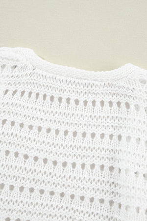 White open-knit dolman sleeve cardigan with a round neckline and breathable acrylic fabric.