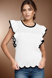 White knit top with black scalloped trim and ruffle sleeves.
