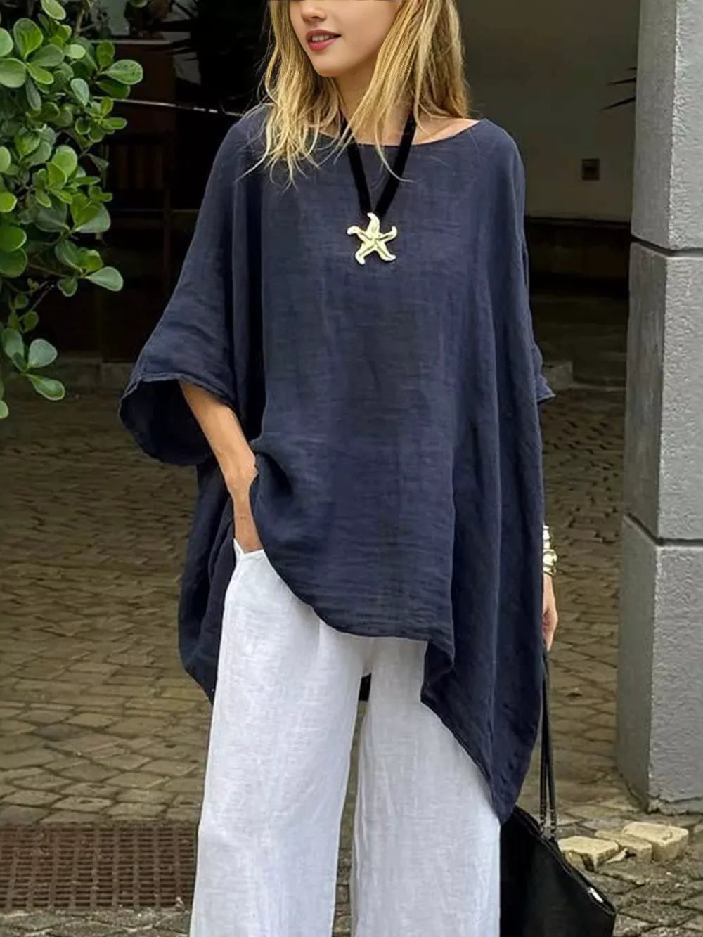 Full Size Loose Fit Asymmetrical Hem Top in Navy Blue, back view