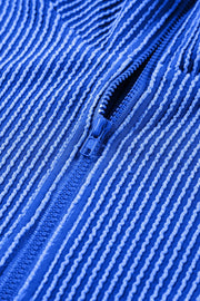 Royal blue textured ribbed polo short set with a zipper detail.