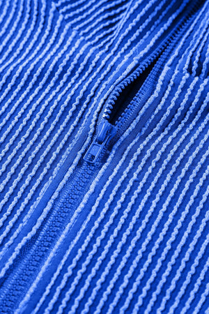 Royal blue textured ribbed polo short set with a zipper detail.