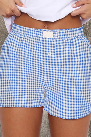 Light blue gingham boxer shorts with high-rise elastic waist and button fly.