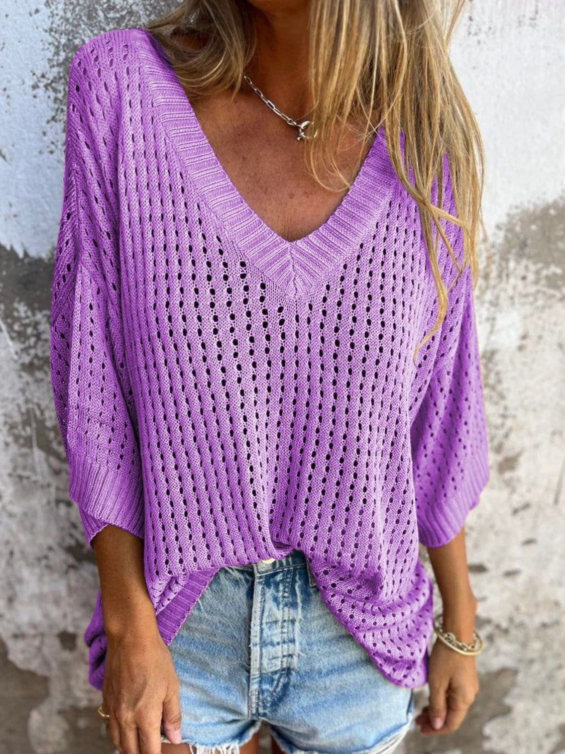 Open-knit heliotrope purple V-neck relaxed beach pullover sweater with short sleeves.