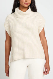 Sleeveless ribbed turtleneck sweater in ivory, featuring a relaxed fit and cozy knit.