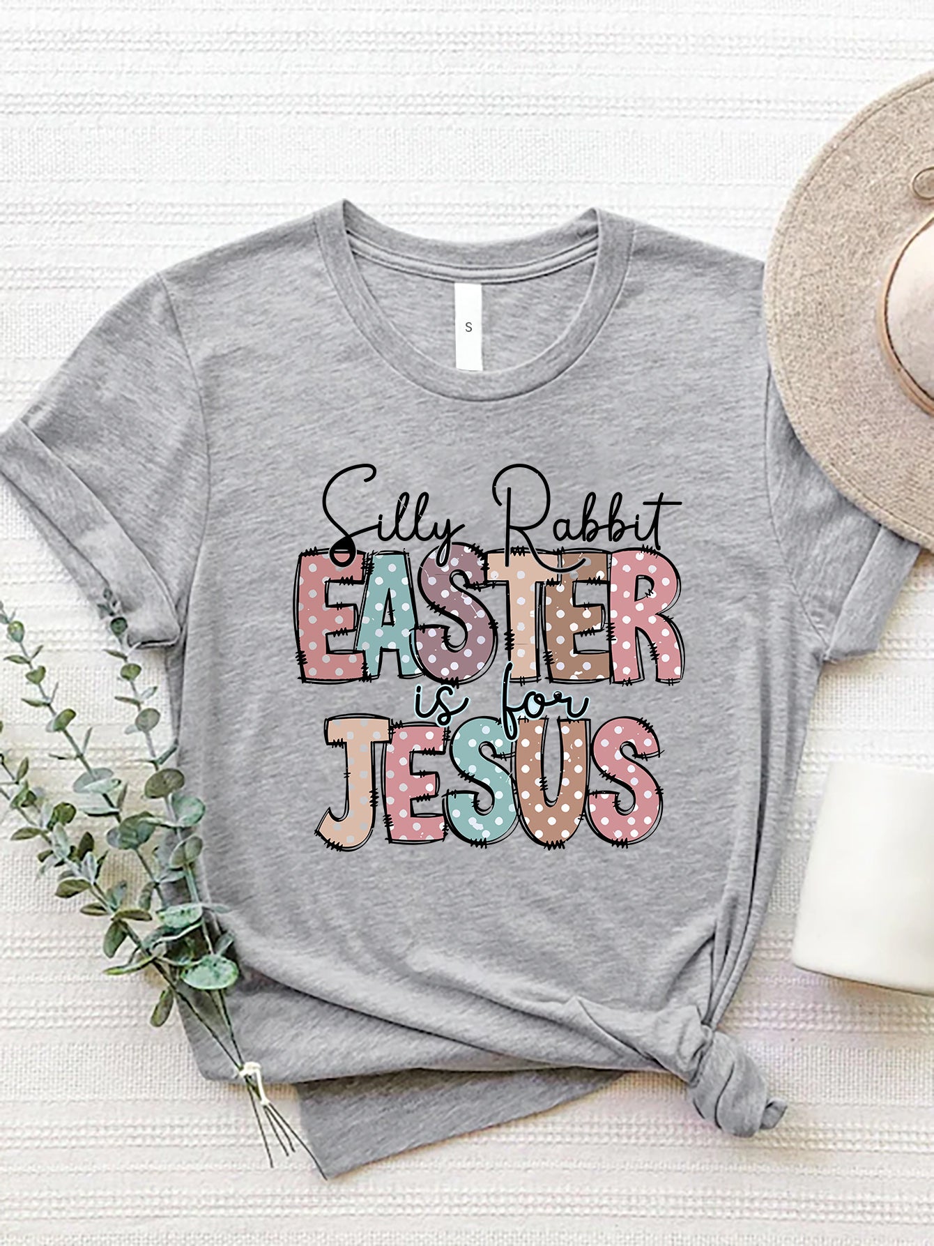 Gray polyester Easter graphic tee with pastel polka dot text that reads "Silly Rabbit Easter is for Jesus".