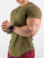 Olive performance tee with black logo detail and curved hem